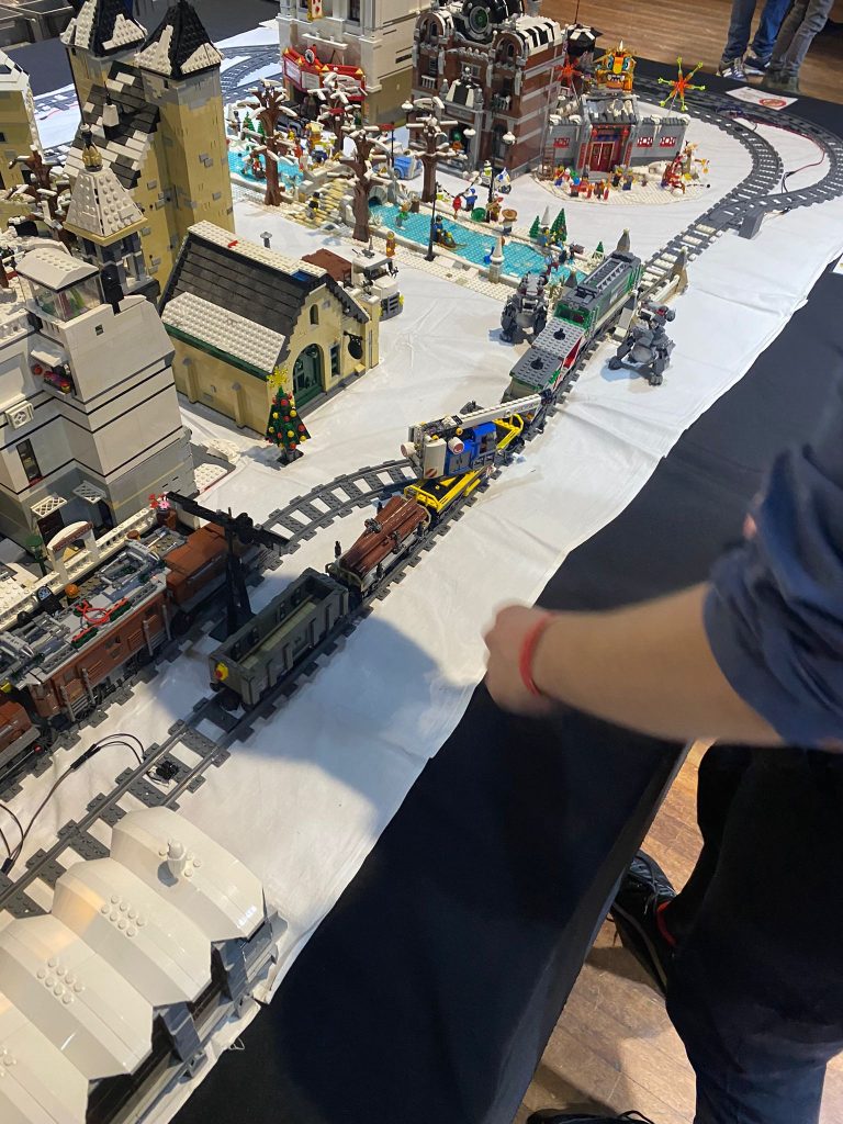 Bricktopia 2021: beautiful LEGO train layout with buildings and skaters on ice