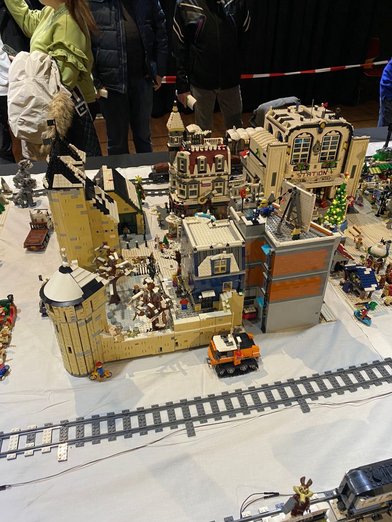 Bricktopia 2021: automated LEGO train layout with castle and modular buildings